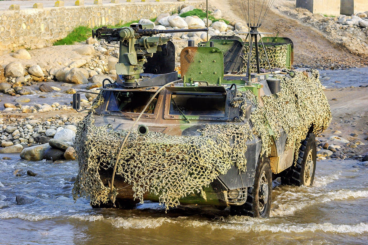 Camouflaged Armoured Tank in a River