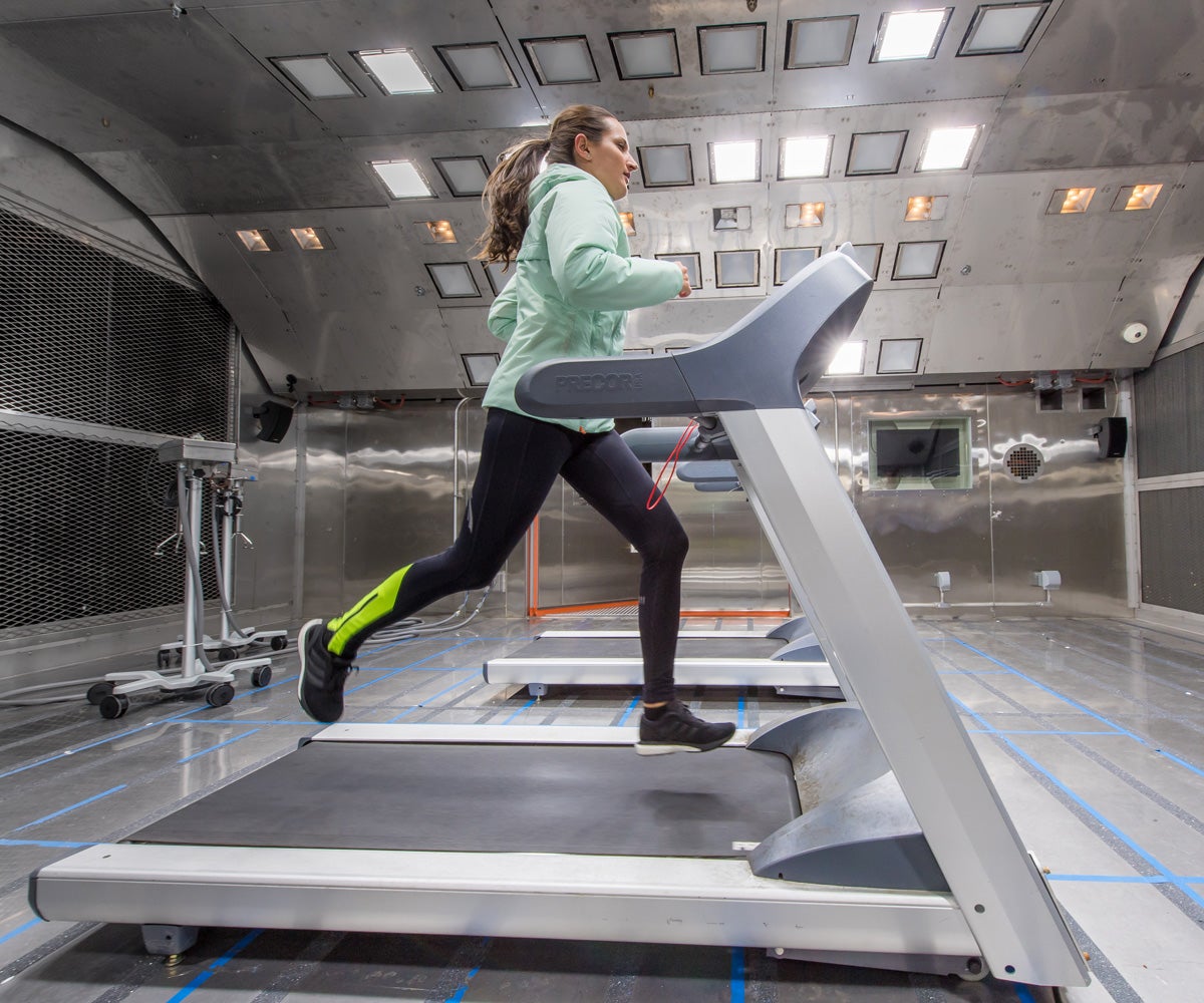 Girl running on a treadmill in the environmental chamber testing our products