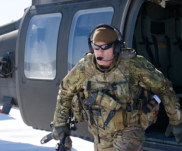 Soldier exiting helicopter