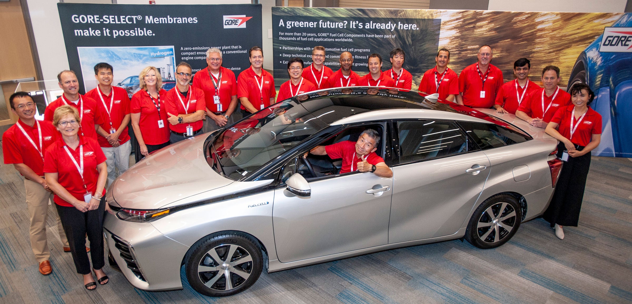 GORE ASSOCIATES GATHER AROUND THE ZERO-EMISSION TOYOTA MIRAI AT AN AUTO INDUSTRY EVENT