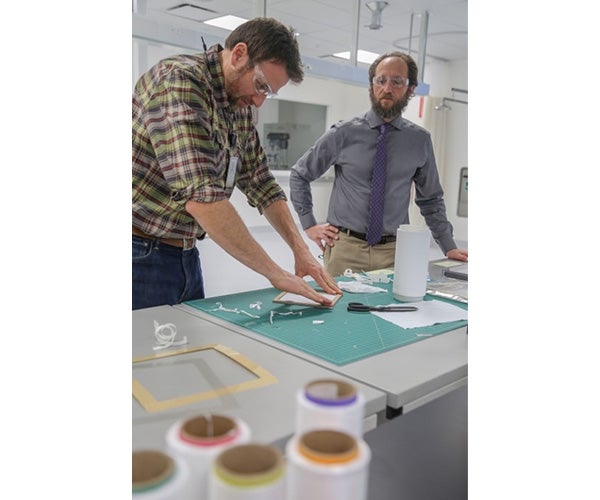 Two Associates working in a lab space