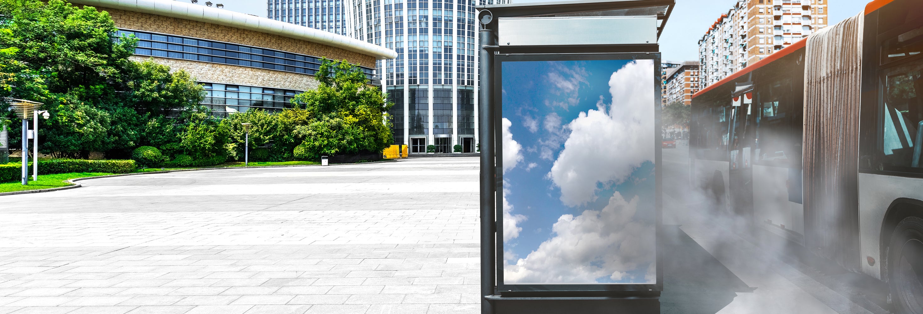 Digital signage at a bus stop in a cloud of pollution from traffic.