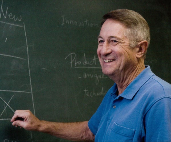 Bob Gore standing at a chalkboard.