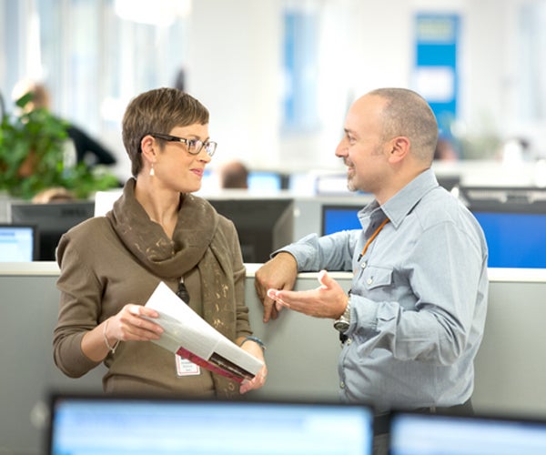 Associates talking in an office setting