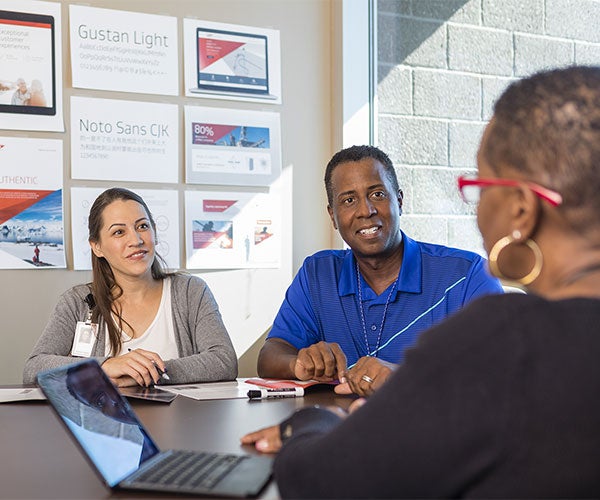 Associates sitting on a table