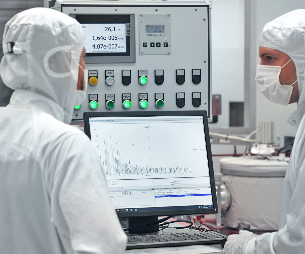 Engineers assessing the cleanliness of a Gore Lithography Cable via Residual Gas Analysis (RGA)