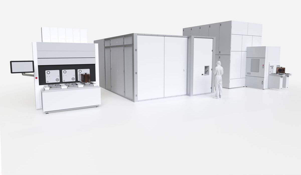 Exterior view of three automated systems for semiconductor inspection.