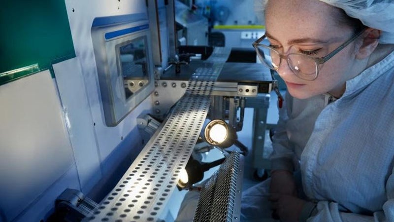 An Associate working on vent production.