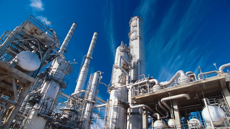 An industrial factory under a blue sky.