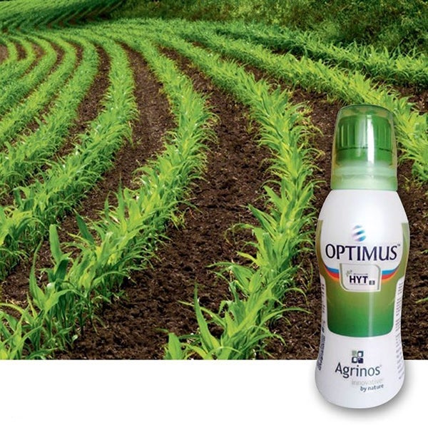 optimus product image over background of crops in field