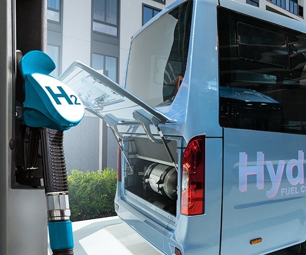 hydrogen powered vehicle next to H2 pump