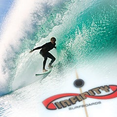 image of surfer riding wave with infinity surfboards logo