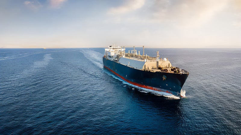 Shipping boat on a vast ocean.