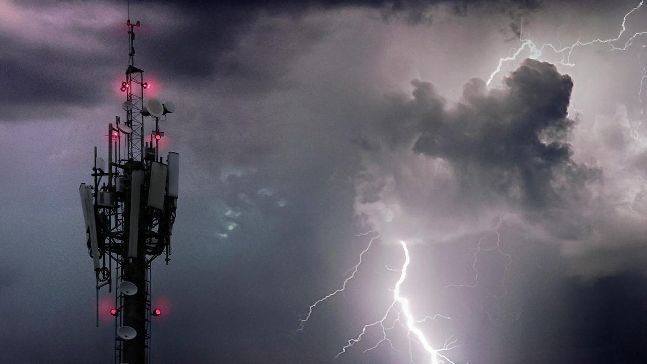 Telecommunications tower beside a storm