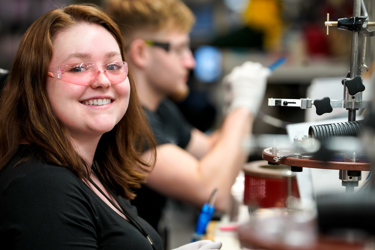 associate working and smiling at the camera