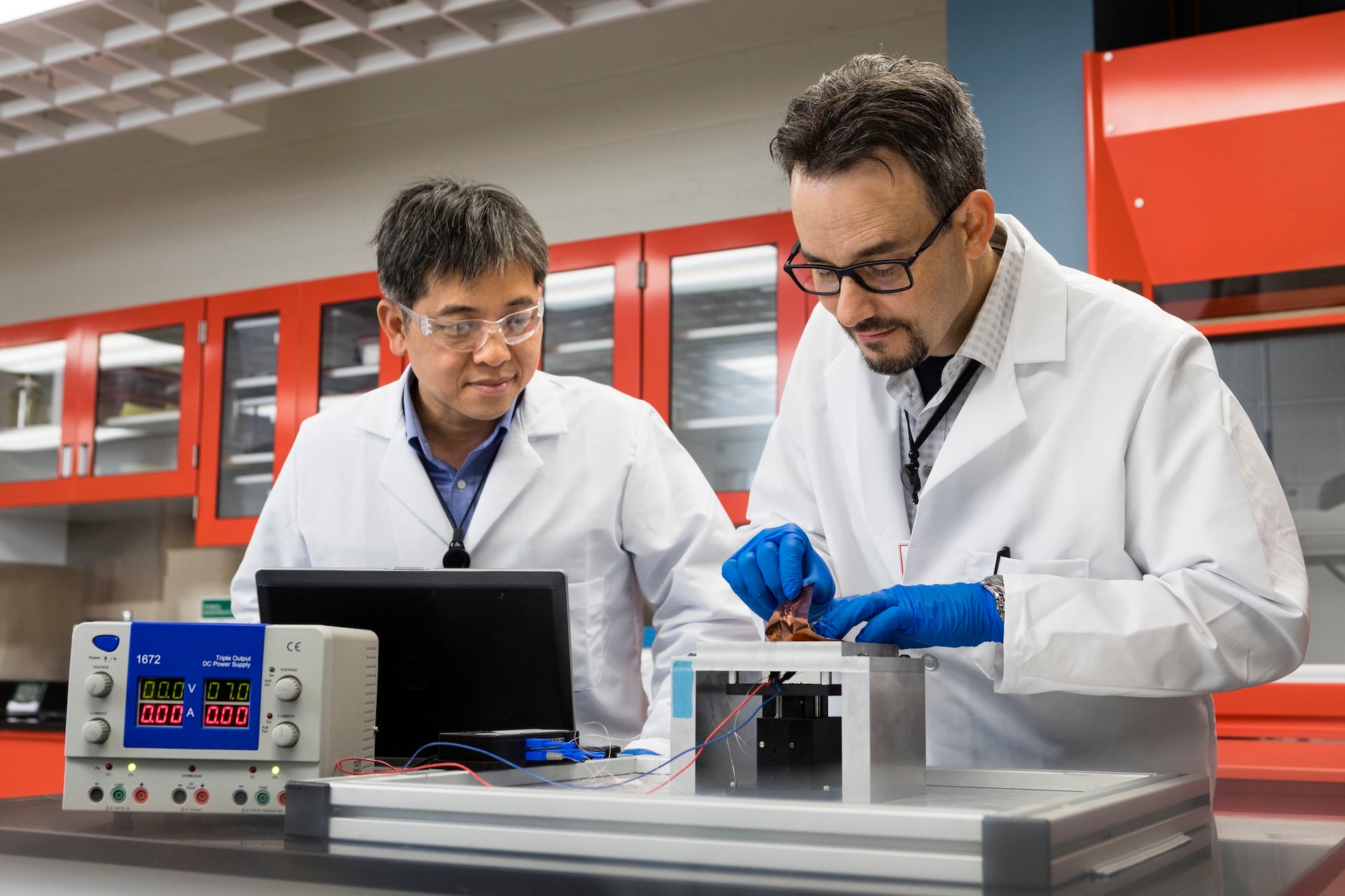 two associates working together in a lab