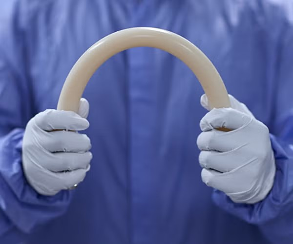 pfl pump tubing held and bent in gloved hands