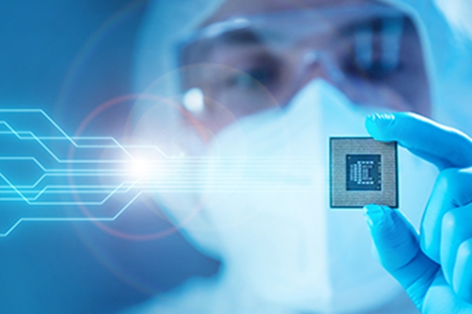 Scientist Holding a Modern Microprocessor Chip in Hand.