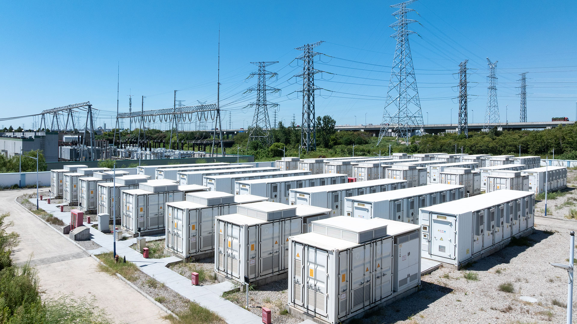 Aerial view of battery energy storage systems under a clear blue sky