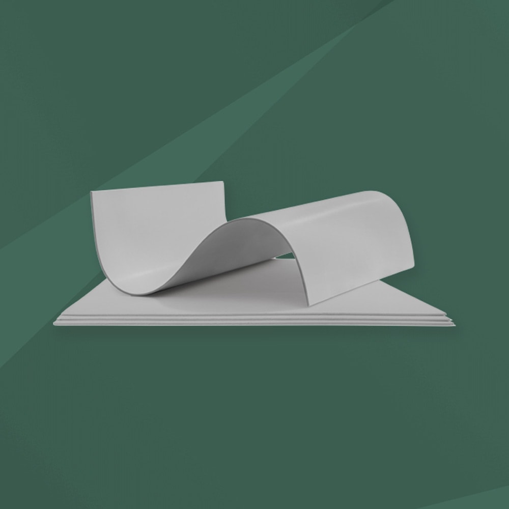 Product close up of GORE GBI Flat Sheets on green textured background