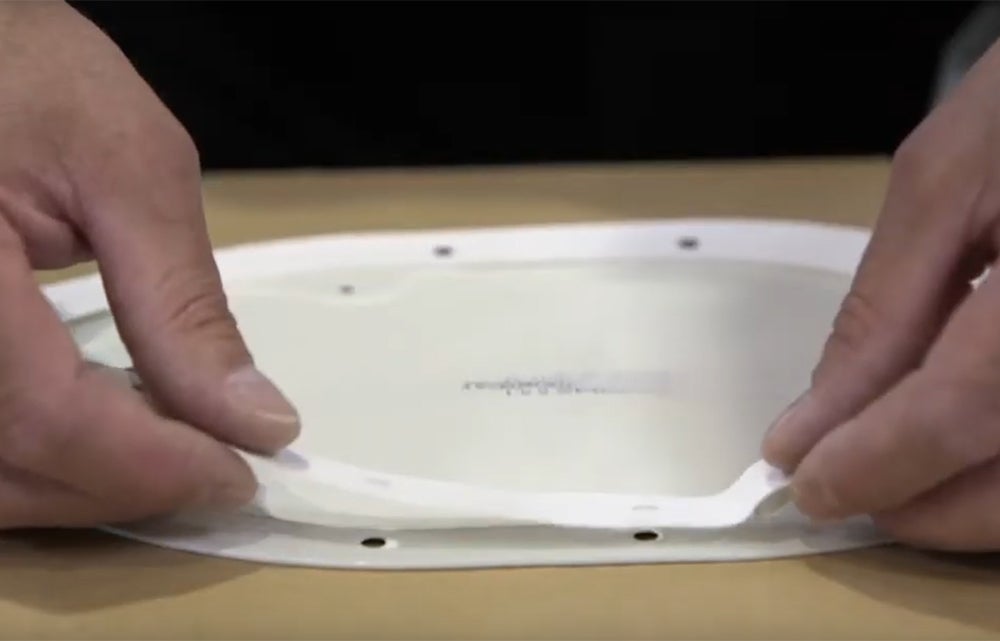 Image of installing a gasket on a panel