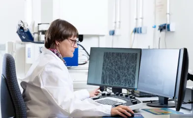 life sciences venting worker at computer