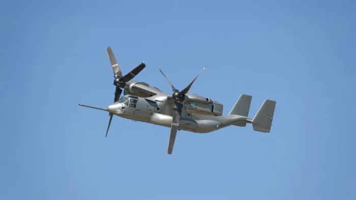 A Bell V-22 , Helicopter, Rotary Wing mid-flight.