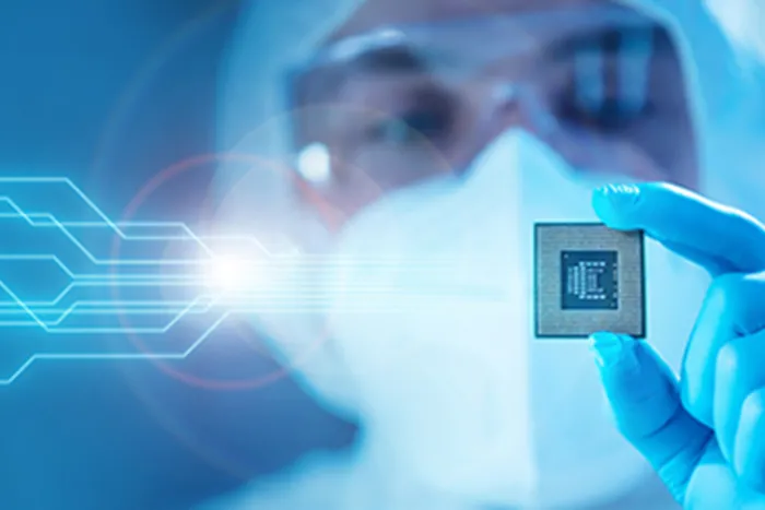 Scientist Holding a Modern Microprocessor Chip in Hand.
