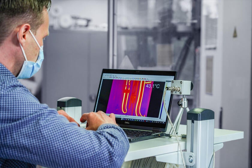 Engineer uses a thermal imaging display to monitor the performance of a GORE® High Flex Cable during a multi-million-cycle Flex Test.