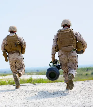 Soldiers running with javelin missile