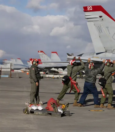 US Marines perform ordnance loading and refueling on 9x sidewinder missile