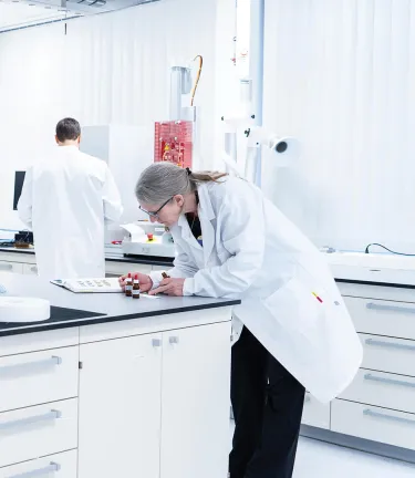 Gore Associates working in a bright lab with equipment.