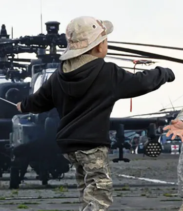 Soldier greets child