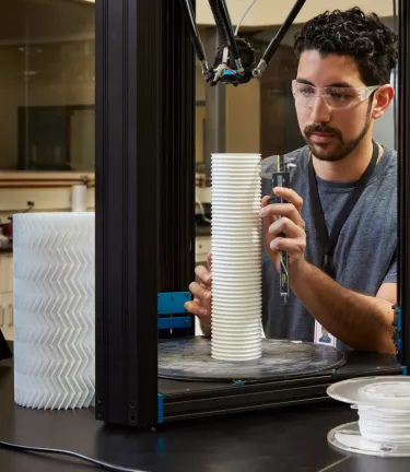 associate examining product in lab