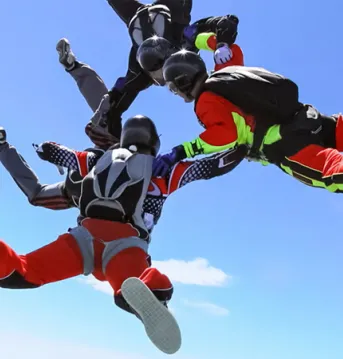 Three enthusiast mid-skydiving