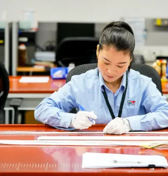 associate working with materials in the plant