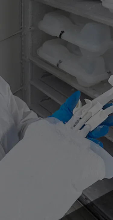Worker holding a GORE® STA-PURE® Flexible Freeze Container