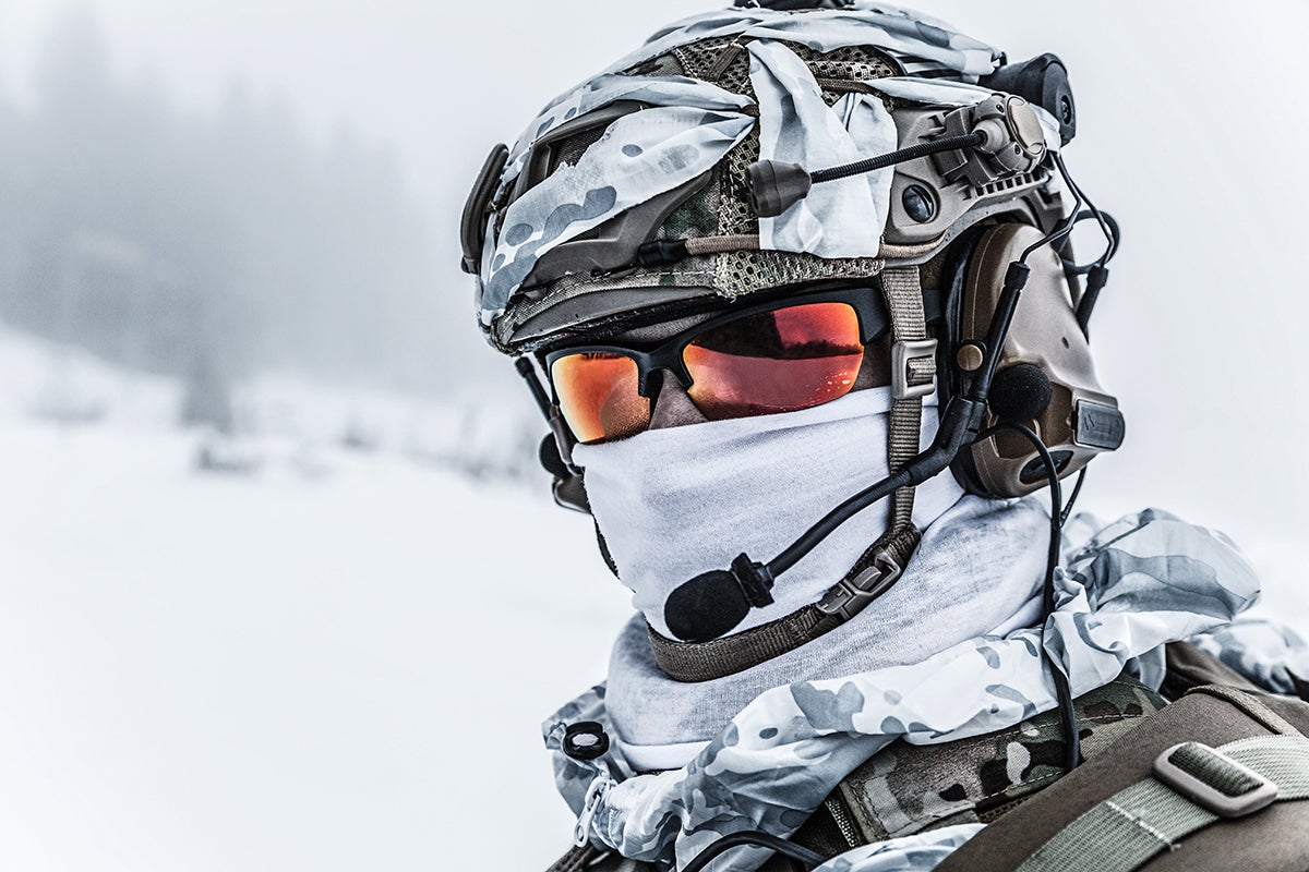 Soldier Wearing Headset Near Arctic Mountains