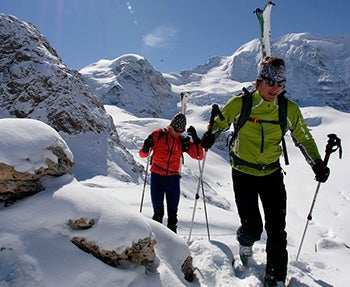 People hiking in the snow covered mountains