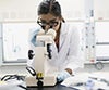 Researcher at work with microscope