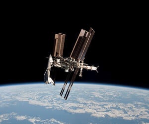 Shuttle docked at a space station